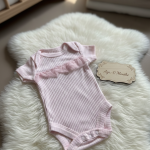 pink bodysuit with ruffles